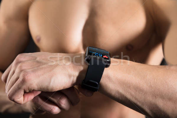 Stock photo: An Athlete Man With A Smart Watch