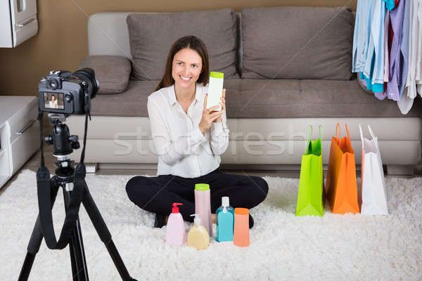 Young Woman Holding Cosmetic Product Stock photo © AndreyPopov