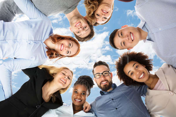 Group Of Happy College Students Forming Huddle Stock photo © AndreyPopov