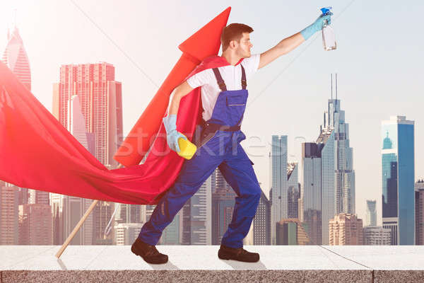 Janitor In Superhero Costume Flying With Rocket Stock photo © AndreyPopov