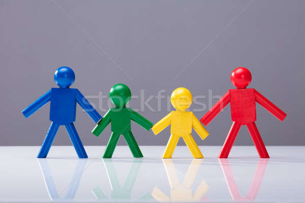 Stock photo: Multi Colored Human Figures Standing In A Row