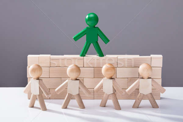 Human Figure Standing On Top Of Wooden Blocks Stock photo © AndreyPopov