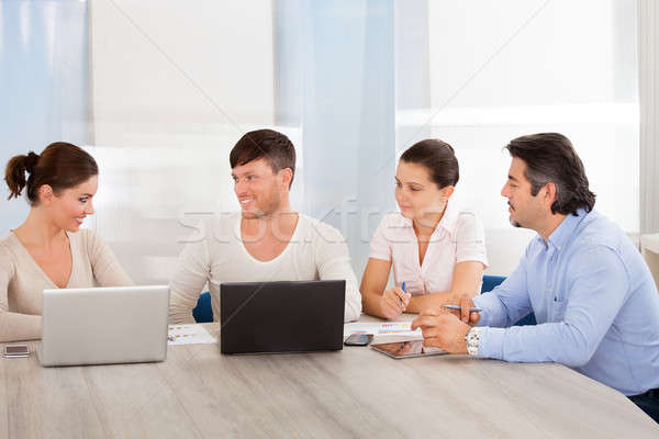 Happy Business People At Office Stock photo © AndreyPopov