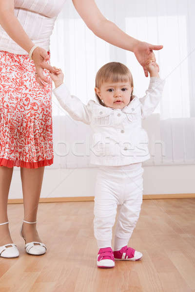 Baby taking her first steps Stock photo © AndreyPopov