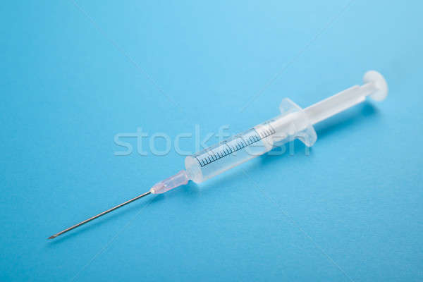 Közelkép injekciós tű kék orvosi háttér gyógyszer Stock fotó © AndreyPopov