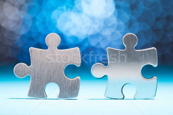 Close-up Of Two Jig Saw Pieces Stock photo © AndreyPopov