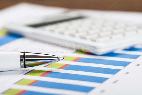 Financial Data Sheet With Calculator And Pen Stock photo © AndreyPopov