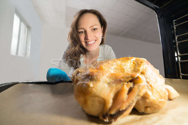 Woman Putting Chicken View From Inside The Oven Stock photo © AndreyPopov