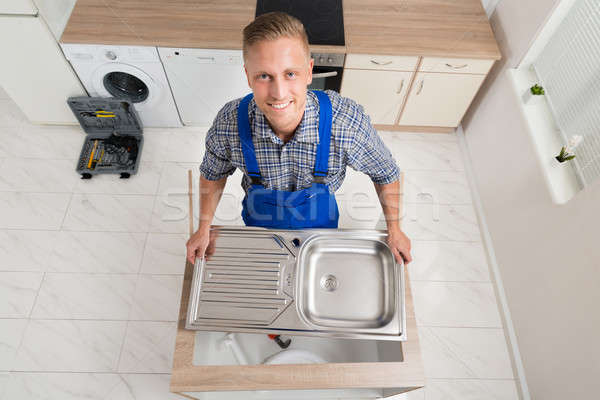 Plumber Fixing Stainless Steel Sink Stock photo © AndreyPopov