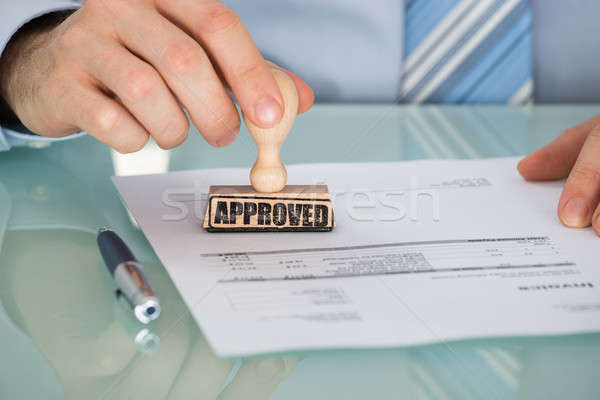 Person's Hand Stamping On Document Stock photo © AndreyPopov