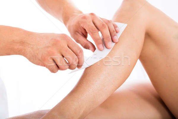 Beautician Waxing Woman's Leg Stock photo © AndreyPopov