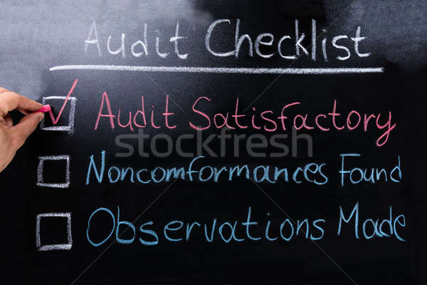 Person's Hand Marking On Checklist Stock photo © AndreyPopov