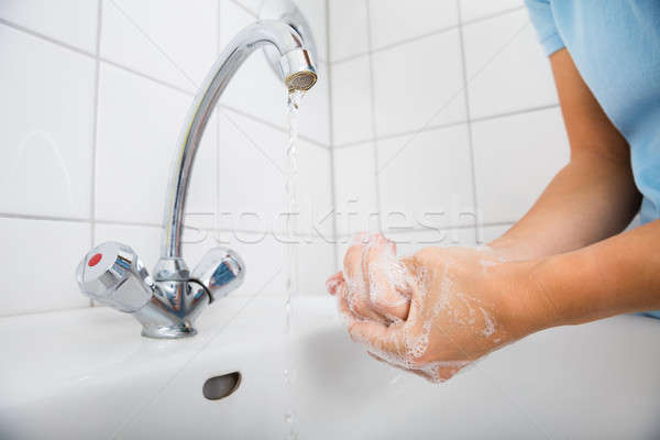 Woman Applying Soap On The Hand Near Basin Stock photo © AndreyPopov