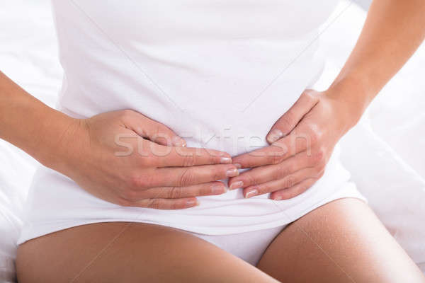 Femme souffrance estomac douleur alimentaire Photo stock © AndreyPopov