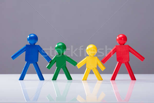Multi Colored Human Figures Standing In A Row Stock photo © AndreyPopov