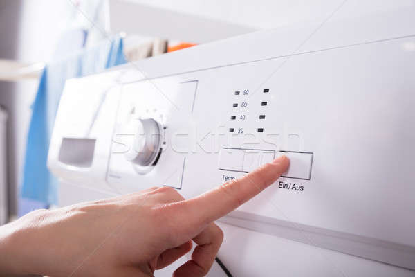 Personne bouton machine à laver personnes [[stock_photo]] © AndreyPopov