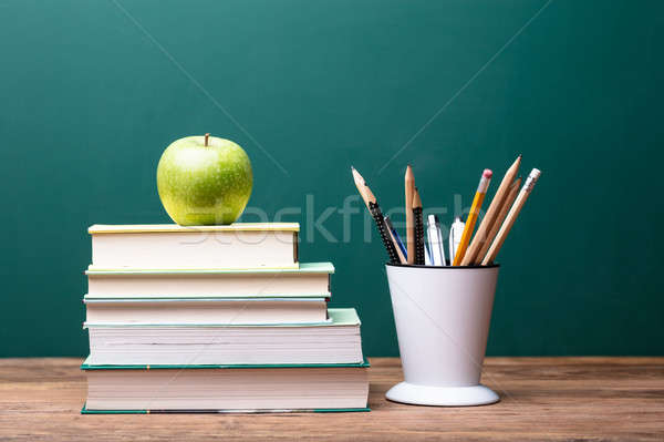 Green Apple On Top Of Stacked Books Stock photo © AndreyPopov