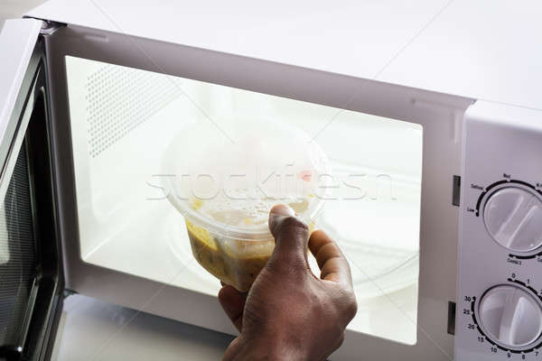 Kéz fűtés étel mikró sütő közelkép Stock fotó © AndreyPopov