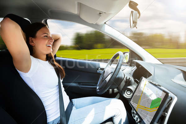 Woman Sitting In Self Driving Modern Car Stock photo © AndreyPopov