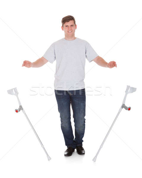 Young Handsome Man Leaving Crutches Stock photo © AndreyPopov
