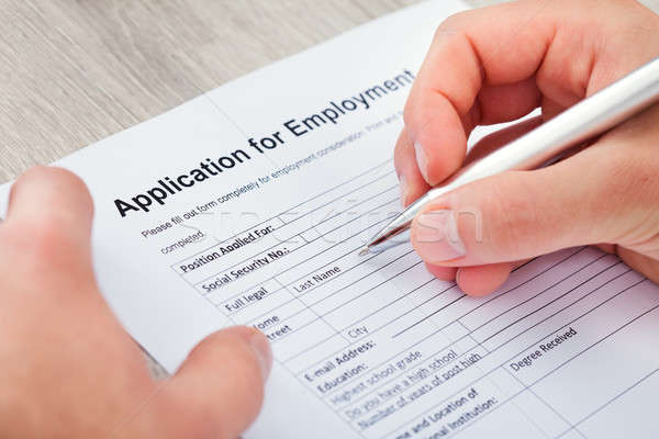 Hand Filling Application For Employment Stock photo © AndreyPopov