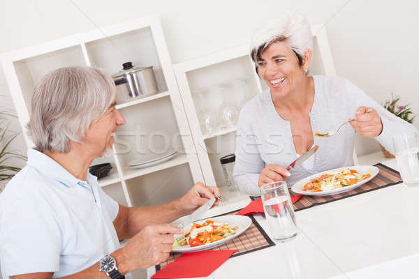 Senior couple eating a meal Stock photo © AndreyPopov