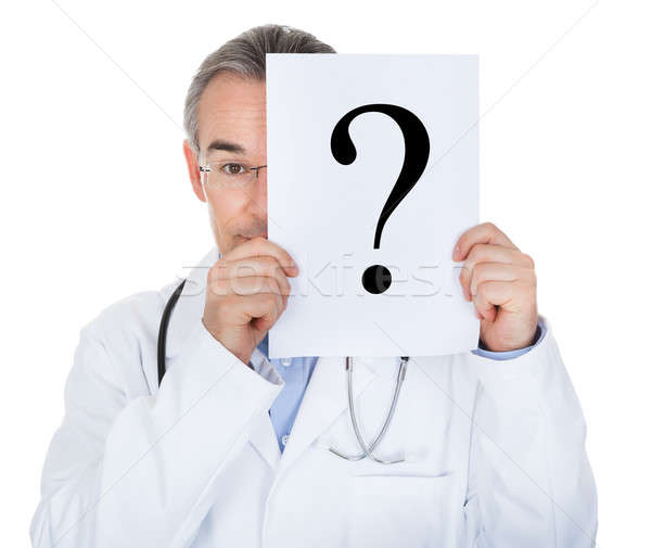 Stock photo: Portrait of doctor holding paper with question mark