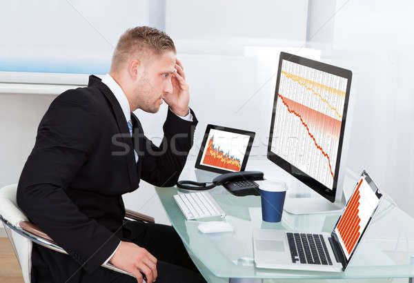 Despairing businessman faced with financial losses Stock photo © AndreyPopov