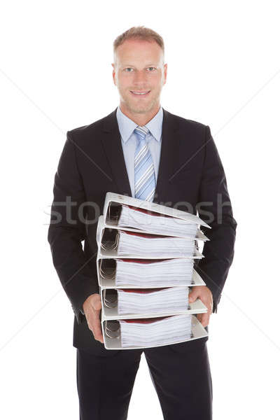 Businessman Carrying Stack Of Binders Stock photo © AndreyPopov