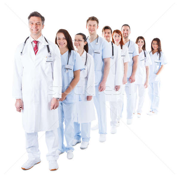 Long line of smiling doctors and nurses Stock photo © AndreyPopov