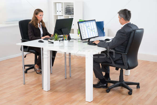Two Businesspeople In Office Stock photo © AndreyPopov