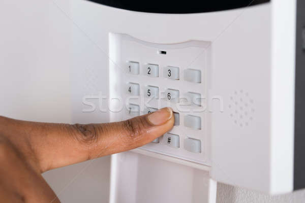 Person's Hand Entering Code In Security System Stock photo © AndreyPopov