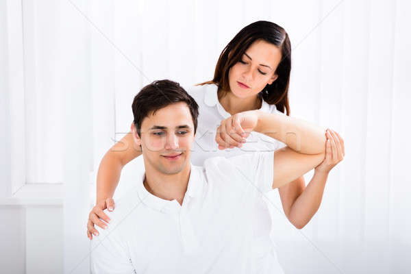 Masseur Massage Mann junger Mann spa Frau Stock foto © AndreyPopov