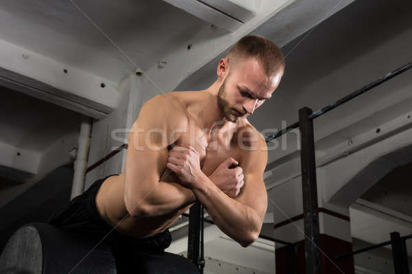 Man Doing Core Exercise On Exercise Equipment Stock photo © AndreyPopov