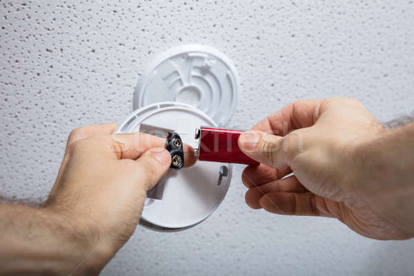 Person Removing Battery From Smoke Detector Stock photo © AndreyPopov