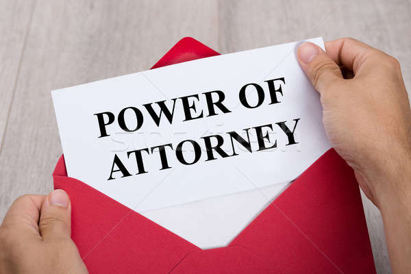 Person Holding Power Of Attorney Document In Envelope Stock photo © AndreyPopov
