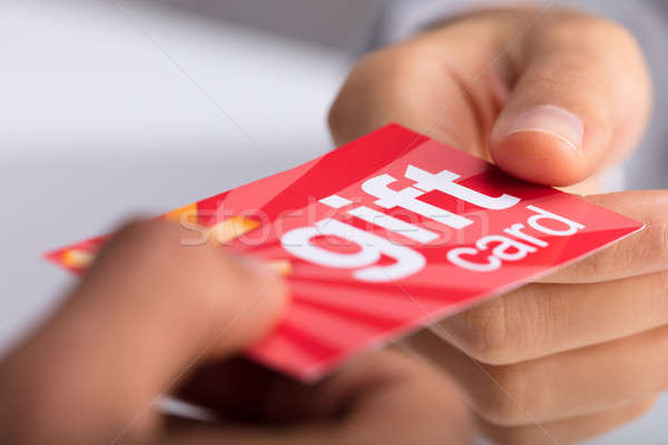 Stock photo: Two Businesspeople Holding Gift Card