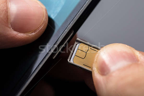 Inserting A Sim Card In A Mobile Phone Stock photo © AndreyPopov