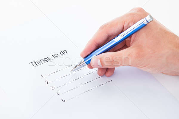 Hand filling things to do list Stock photo © AndreyPopov