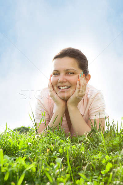 Young Woman Relaxing In Grassland Stock photo © AndreyPopov