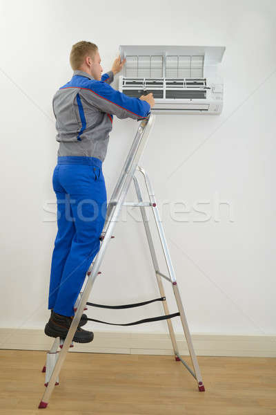 Male Technician Repairing Air Conditioner Stock photo © AndreyPopov