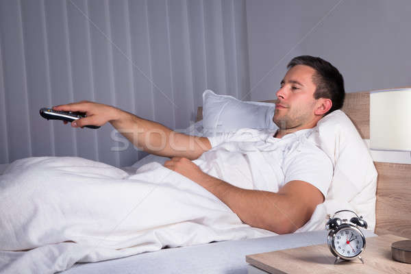 Stock photo: Man Changing Television Channels