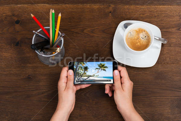 Person With Mobile Phone Showing Video Stock photo © AndreyPopov