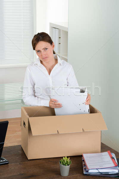 Businesswoman Putting Her Belongings In Box Stock photo © AndreyPopov