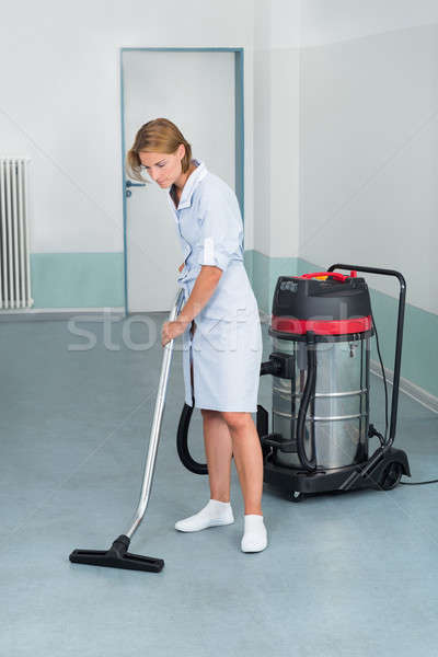 Female Cleaner Vacuuming Floor Stock photo © AndreyPopov