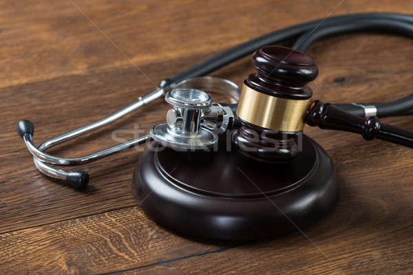 Stock photo: Gavel And Stethoscope On Table