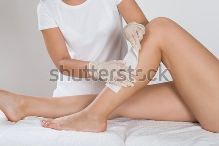 Beautician Waxing Woman's Leg At Salon Stock photo © AndreyPopov