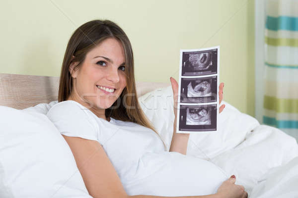Jeune femme ultrasons photo jeunes heureux [[stock_photo]] © AndreyPopov