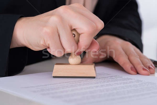 Businessperson Using Stamper On Document Stock photo © AndreyPopov
