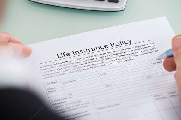 Person Filling Life Insurance Policy Form Stock photo © AndreyPopov